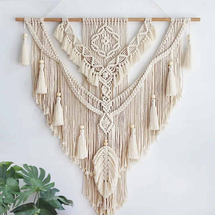 Hand-woven macrame wall hanging in Nordic boho style, featuring tassels and 100% cotton material. Perfect for adding a cozy and natural touch to any space.