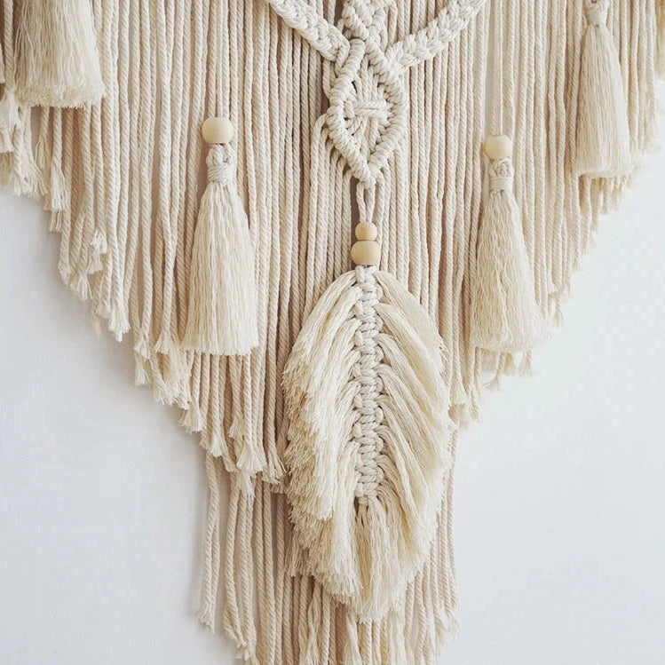 Hand-woven macrame wall hanging in Nordic boho style, featuring tassels and 100% cotton material. Perfect for adding a cozy and natural touch to any space.