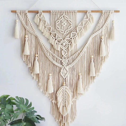 Hand-woven macrame wall hanging in Nordic boho style, featuring tassels and 100% cotton material. Perfect for adding a cozy and natural touch to any space.