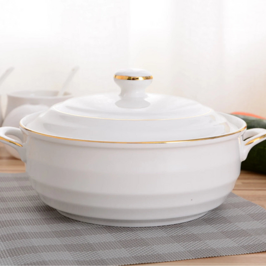 Nordic white ceramic soup pot with a round shape and lid, perfect for serving soups and stews.