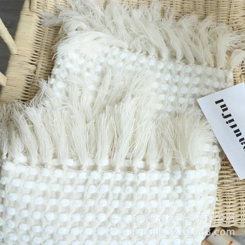 Nordic white knitted blanket, soft and cosy. Perfect for contemporary spaces, adds warmth and charm. Ideal for sofas, beds, and hotel stays, creating a relaxing vibe.