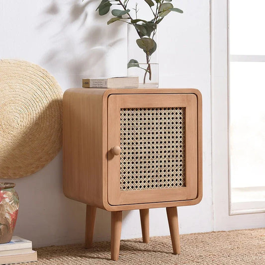 Retro-inspired mini storage cabinet with natural rattan front and sleek legs, perfect for adding style and storage to any room in your home.