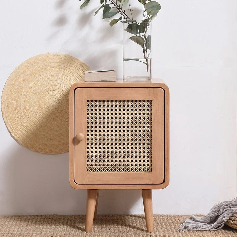 Retro-inspired mini storage cabinet with natural rattan front and sleek legs, perfect for adding style and storage to any room in your home.