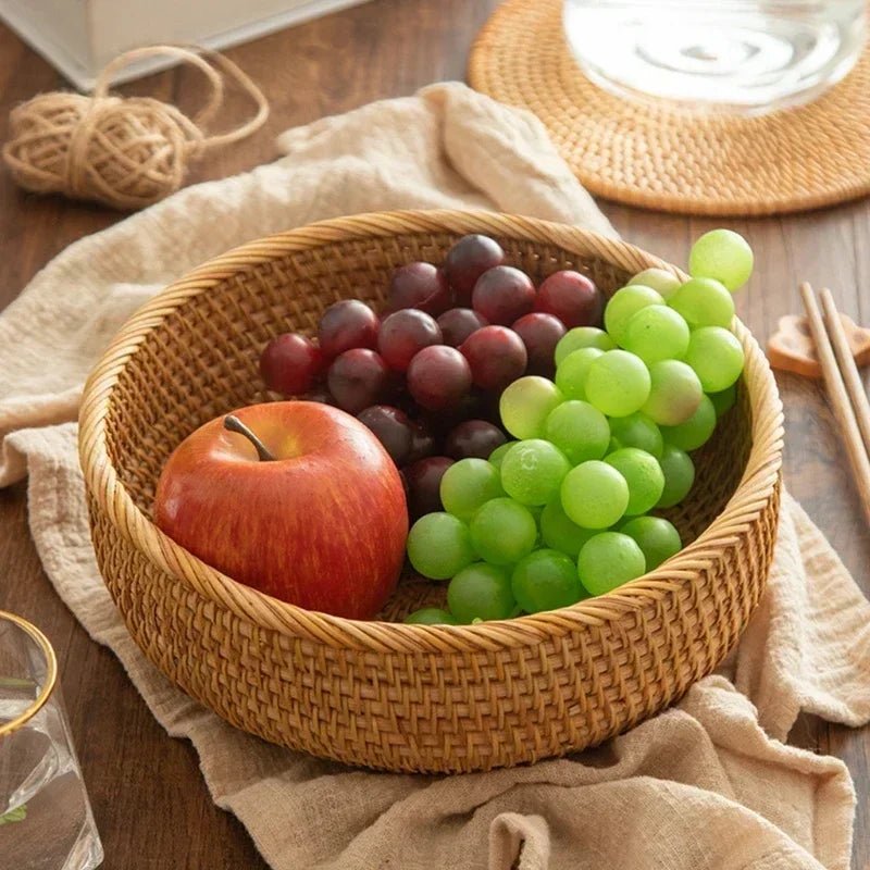 Round rustic fruit basket filled with grapes and apples