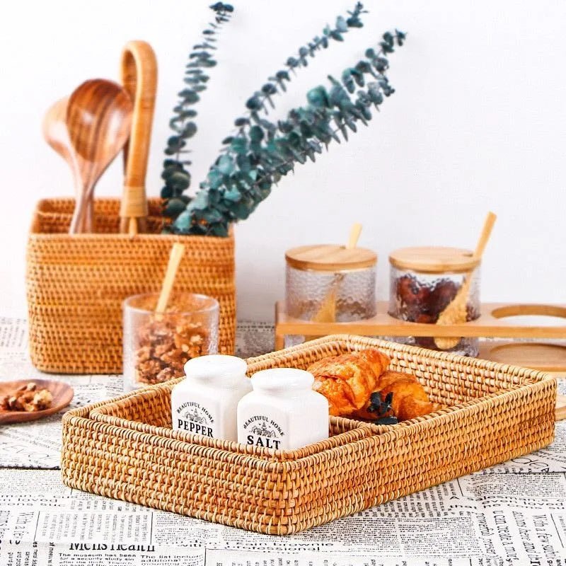 A rustic fruit basket filled with salt containers and two croissants