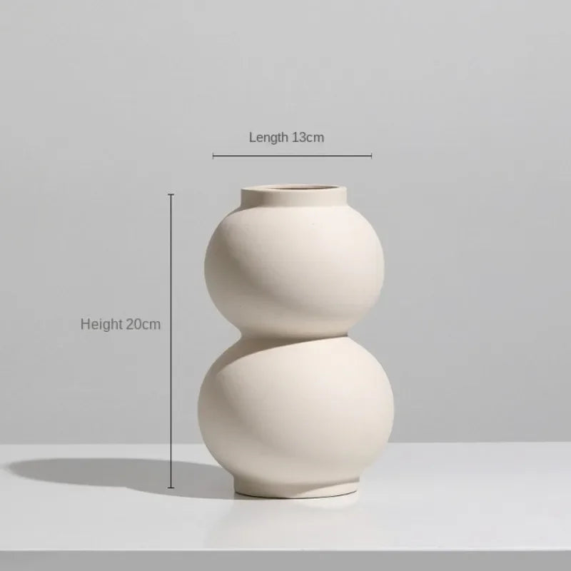 A simple charm ceramic vase with a minimalist design, perfect for adding elegance to any home decor.