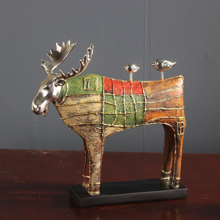 Sophisticated Painted Deer Sculpture with gold details, in green, red, and brown, perfect for adding vintage charm to any room.