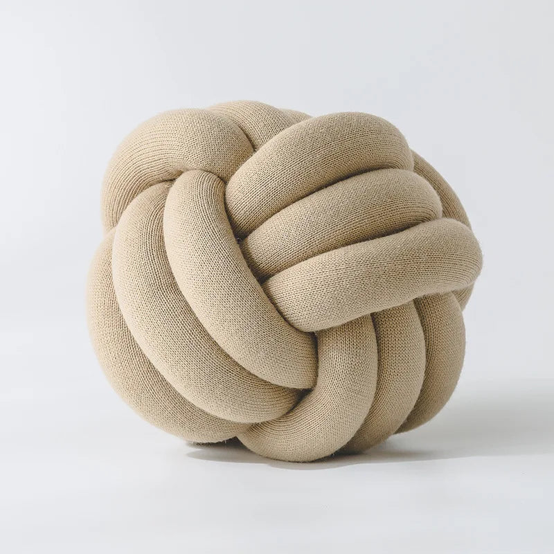 Stylish Knot Ball Sofa Cushion in a modern living room setting, featuring a soft, plush design