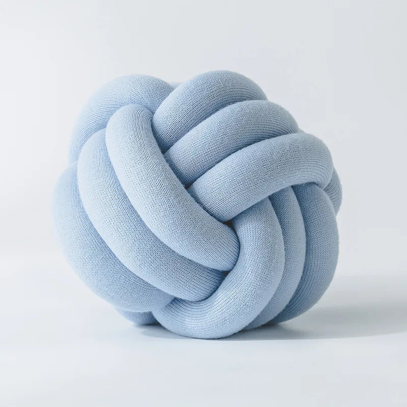 Stylish Knot Ball Sofa Cushion in a modern living room setting, featuring a soft, plush design