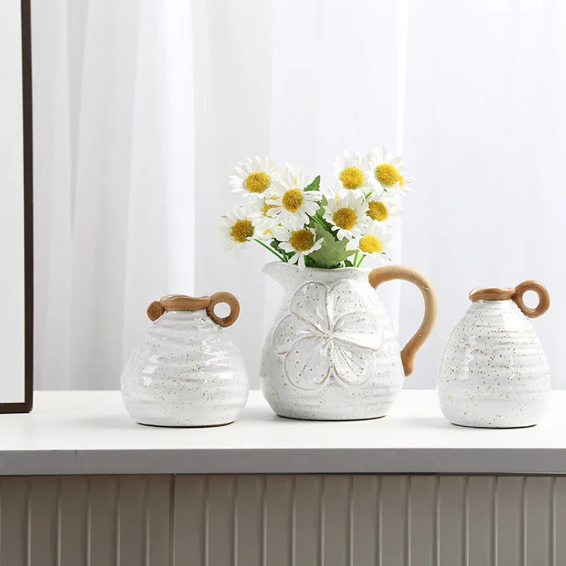 Three Vintage Charm Ceramic Vases with handles, displaying intricate vintage designs perfect for adding an elegant touch to home decor.