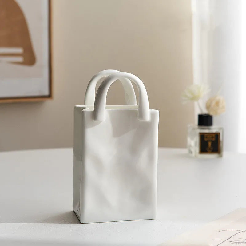 A tote-style ceramic vases filled with flowers, showcasing its elegant design and functionality for modern and classic home decor.