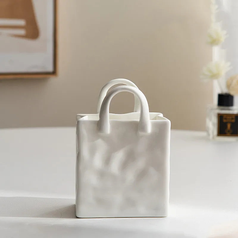 A tote-style ceramic vases filled with flowers, showcasing its elegant design and functionality for modern and classic home decor.