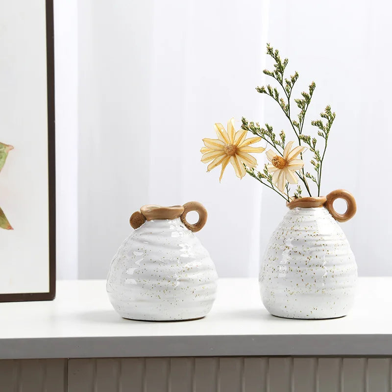 Two Vintage Charm Ceramic Vases with handles, displaying intricate vintage designs perfect for adding an elegant touch to home decor.