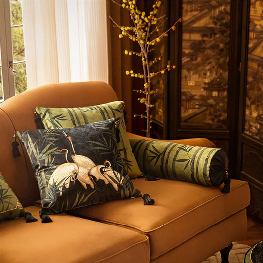 Velvet cushion cover with bamboo leaves and white crane design in green, beige, and black tones, perfect for adding a modern, calming touch to any room.