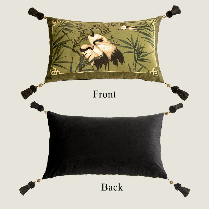 Velvet cushion cover with bamboo leaves and white crane design in green, beige, and black tones, perfect for adding a modern, calming touch to any room.