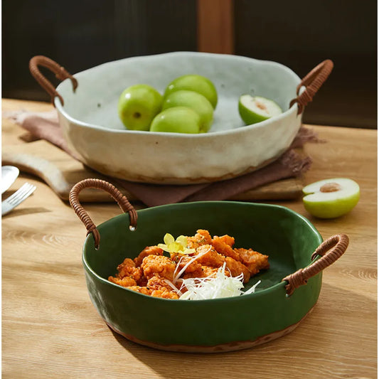 Vintage clay serving bowl with woven handles, perfect for meals or as a decorative centrepiece.