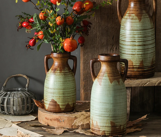 A beautifully crafted vintage two-handled ceramic vase with intricate detailing.