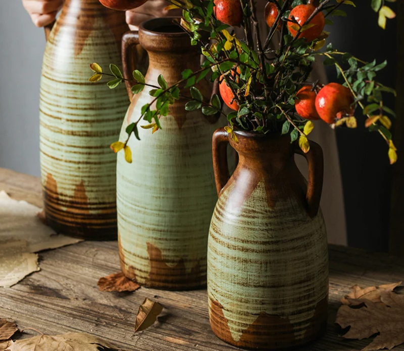 A beautifully crafted vintage two-handled ceramic vase with intricate detailing.