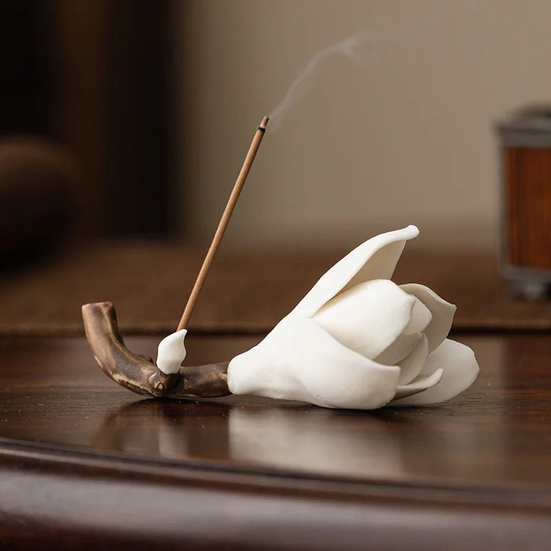 A white ceramic Bloom Incense Holder with a delicate flower design, perfect for adding a touch of elegance to any space.