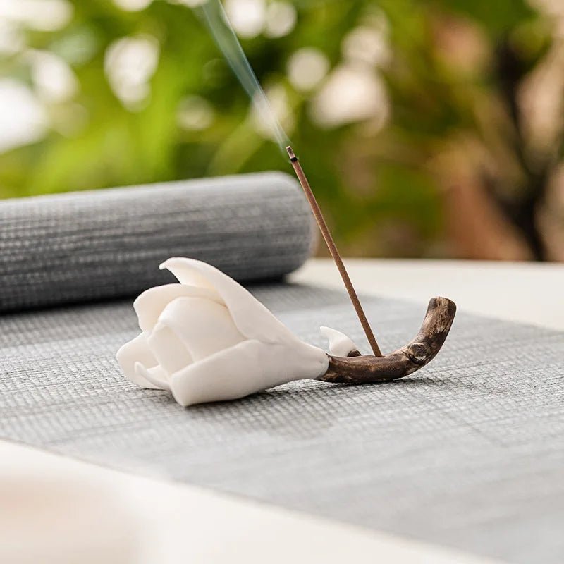 A white ceramic Bloom Incense Holder with a delicate flower design, perfect for adding a touch of elegance to any space.