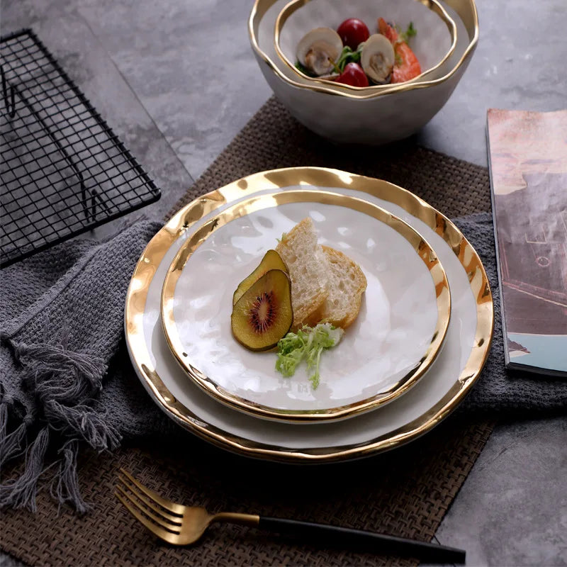 Elegant white serving plate and bowl with a gold rim, perfect for upscale dining and special occasions.