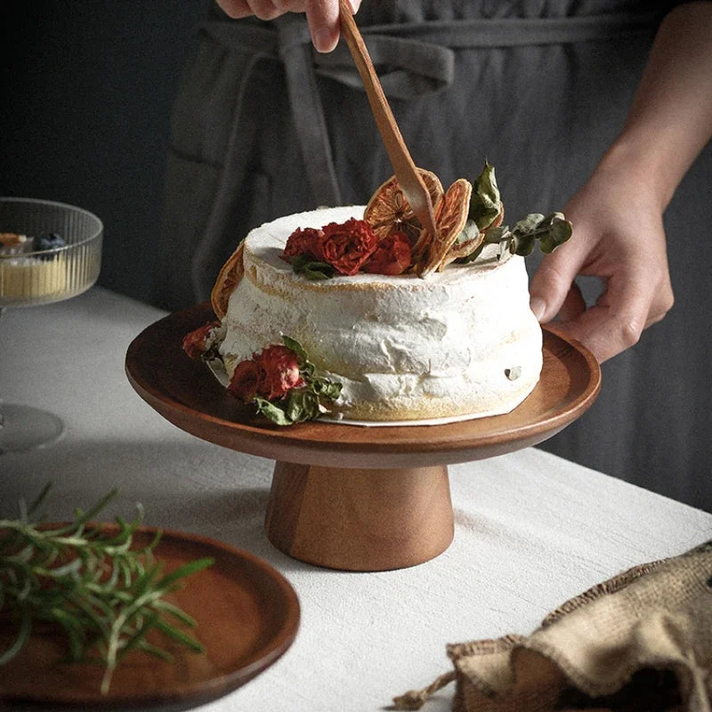 Wood cake stand with smooth edges, perfect for displaying desserts and pastries.